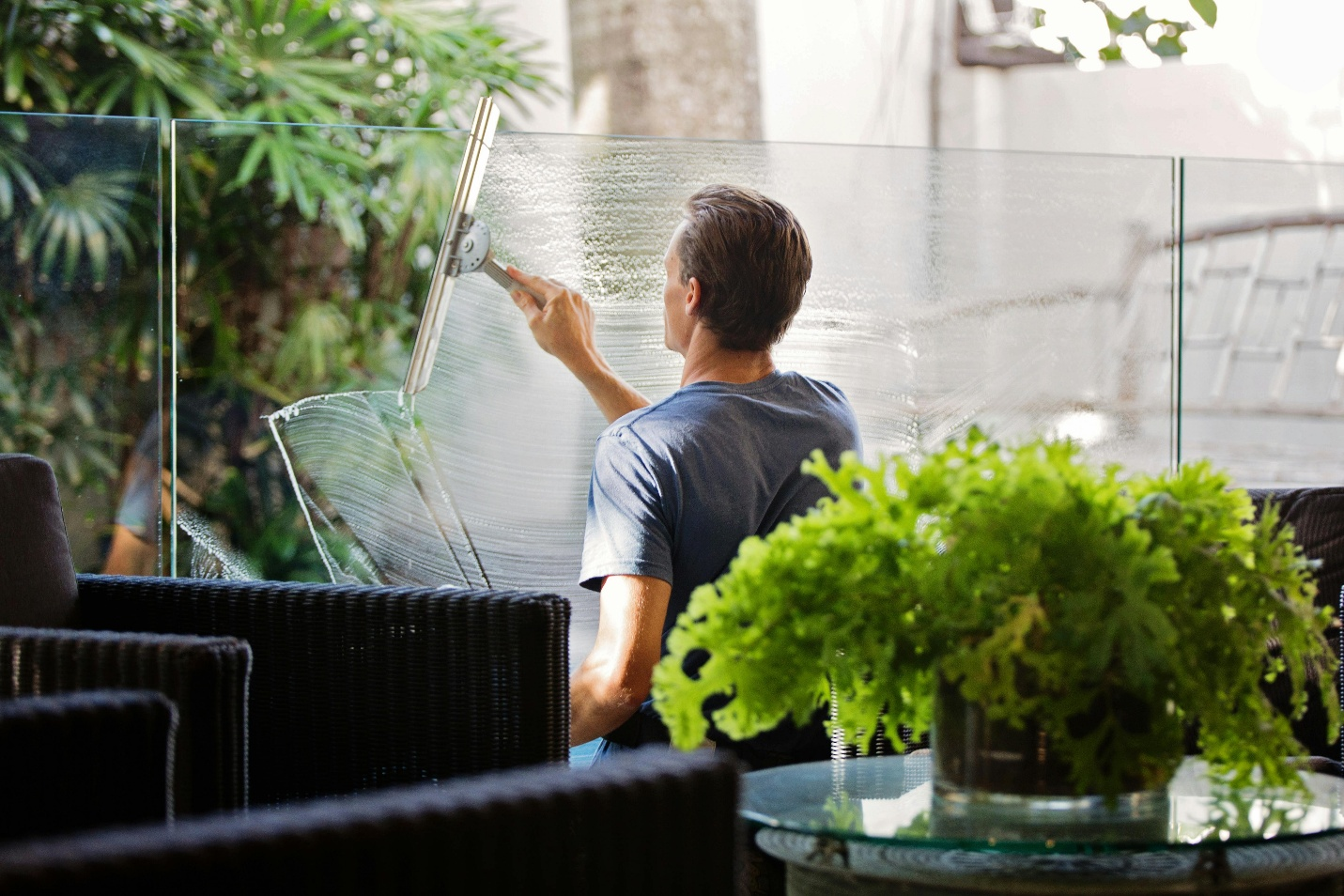 A person cleaning a window